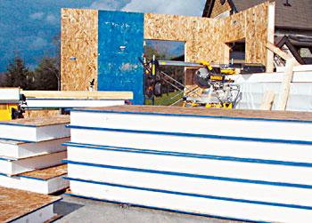 
Looking sort of like an ice cream sandwich, these structural insulated panels (SIPs) are made of foam and oriented strand board. Highly energy efficient, they also are easy to use; just cut them to your desired shape and hoist them into place.
